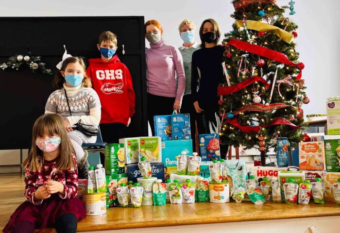 St. Columba Sunday School students (some of whom are pictured above with Diana Poitras, second from right) spent the four weeks of Advent gathering baby-related items, such as food, formula and diapers. In December, these items were donated to the Youville Centre, a non-profit registered charity that supports young mothers. Photo: Melissa Hammell