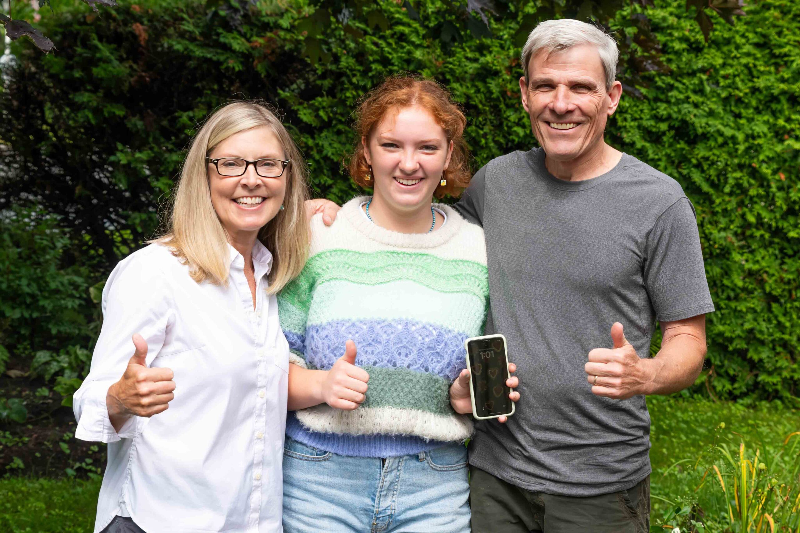 Thanks to the Manor Park listserve, Christine and Paul MacMillan helped Sloane Smith (centre) recover the mobile phone she lost in Italy. Photo: Doug Banks