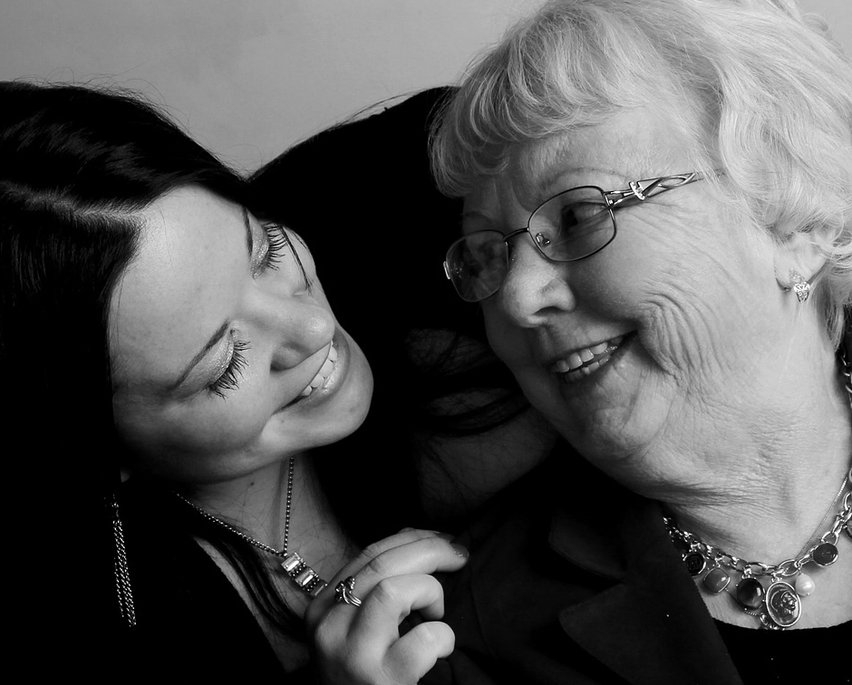 An image of woman gazing fondly at her grandmother