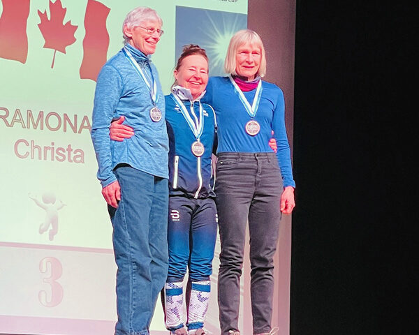 Manor Park resident Christa Ramonat (right) poses with the other medalists on the podium following her successful race at the 2025 Masters World Cup in Klosters, Switzerland. PHOTO: ROGER RAMONAT