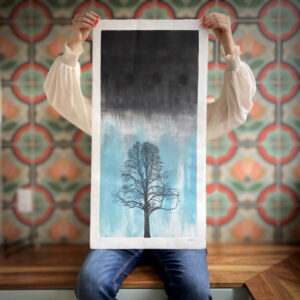 Artist and Manor Park resident Sarah Hallman holds up one of her stunning prints. PHOTO: Submitted
