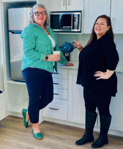 Enjoying a cup of tea in one of the newly renovated alcove suites at The Edinburgh Retirement Residence, 10 Vaughan Street, is Sarah Laflamme, executive director and Nicole Nixon, retirement living consultant. PHOTO: COURTESY OF THE EDINBURGH.