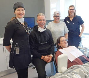Dr. Luc Ducharme recently celebrated his 30th anniversary as a dentist. His practice at 230 Beechwood Ave., runs an annual clinic to support community residents in need of dental services. Shown here at his November 2025 clinic (left to right) are Dr. Jacynthe Desjardins, Dr. Ducharme, Anne, their office manager and Fanny, a dental assistant. PHOTO: SHARLEEN TATTERSFIELD