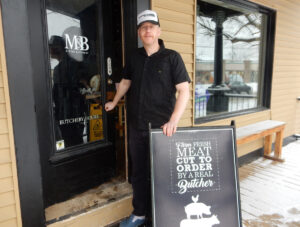 “Here ye, hear ye … the butcher IS in!”  Andrew Muckleston of M & B Butchery at 127 Beechwood Avenue is keen for readers to know that his butcher shop is open for business despite the large realtor sign on edge of the property. PHOTO: SHARLEEN TATTERSFIELD