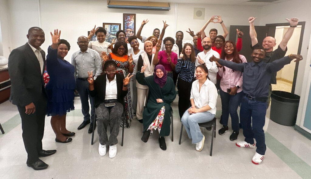 Members of the 2025 free income tax clinic volunteer cohort are all smiles as they join some staff members from RRCRC for a photo. PHOTO: SUBMITTED