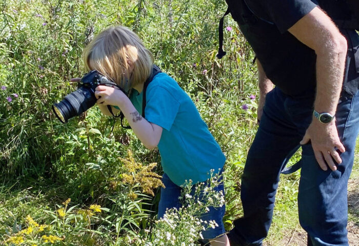 Dave Keys offers some photography advice to grandson Louis. PHOTO: SUBMITTED