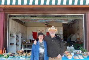 Setting up for a busy weekend at The Farm Store, 1805 Gaspé Avenue are Helena Chouchina, operations manager and Chris Penton, founder and president of Ottawa Street Markets. Save the date: May 16 (10a.m. – 2p.m.). Come celebrate their 4th Anniversary Market with live music, a seedling sale, artisan vendors with the Merry Dairy Truck on site (from 11a.m. to 2p.m.) PHOTO: SHARLEEN TATTERSFIELD
