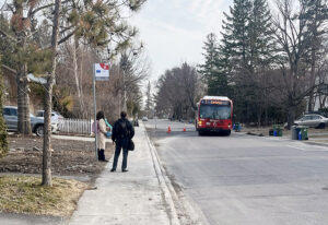 An OC Transpo bus navigates around the patched area on Birch Avenue to pick up passengers near Farnham Crescent. This section was repaired and paved on Tuesday, May 5. PHOTO: RYLAND COYNE