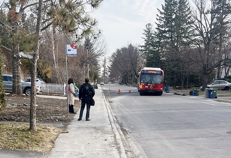 An OC Transpo bus navigates around the patched area on Birch Avenue to pick up passengers near Farnham Crescent. This section was repaired and paved on Tuesday, May 5. PHOTO: RYLAND COYNE