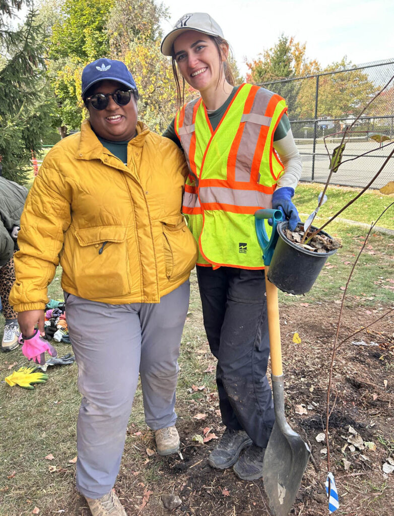 Kavitha Galle Kankanange (left), Community Sustainability Program Coordinator at EnviroCentre and Jodi Newman (right), Afforestation Program Manager at Forêt Capitale Forest pose together during the Tiny Forest planting at Manor Park Public School. PHOTO: VITA SGARDELLO